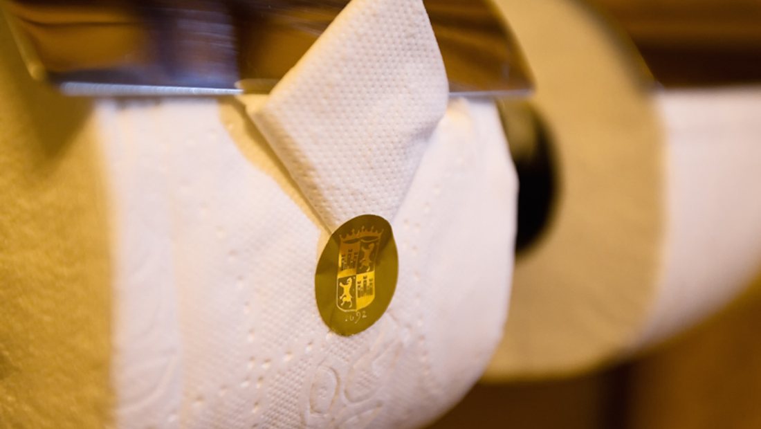 Neatly folded fresh towels and linen for a short-let